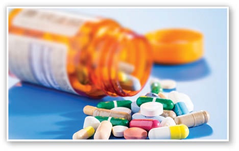 Pills and capsules in medical vial